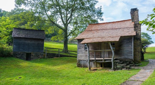 Brinegar Cabin sits on bright green grass