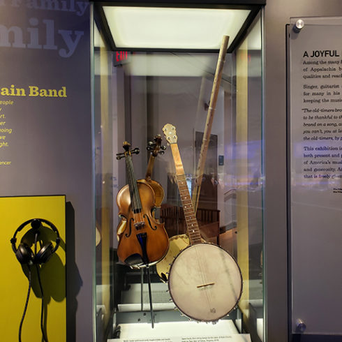 Fiddle and banjo on display at museum exhibit