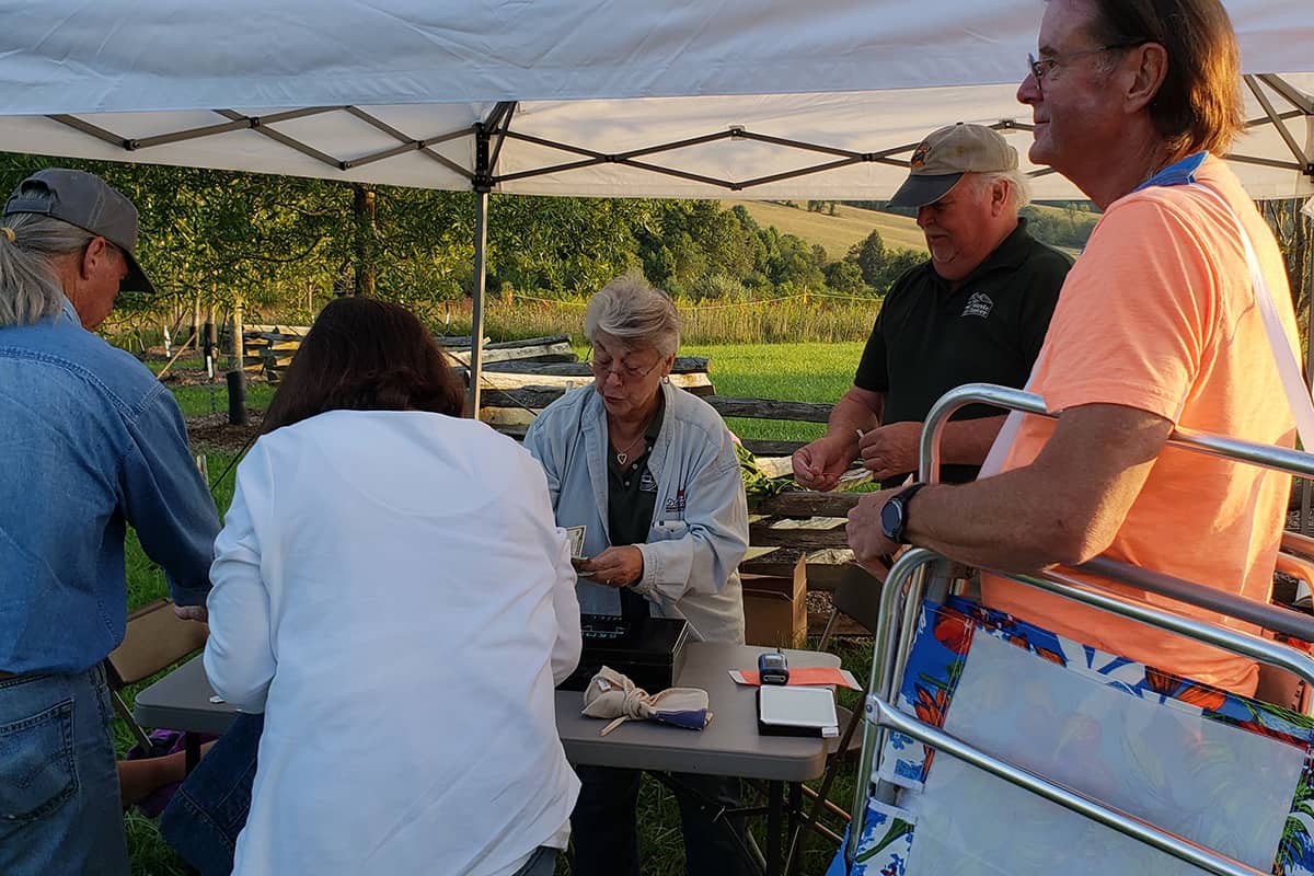 Gate volunteers help guests with tickets