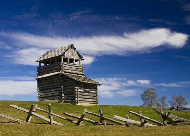 Groundhog Mountain Lookout Tower stands tall next to a blue sky