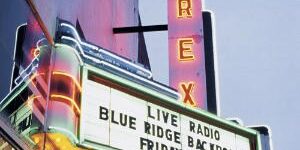 Rex Theater marquee lit up at dusk