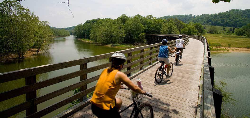 Three bikers crossing a bridge on the Virginia Creeper Trail