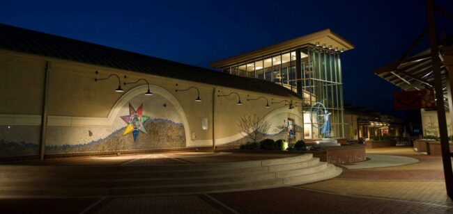 Willingham Theatre with lights on at night
