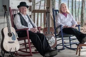 Bill and Maggie Anderson sitting in rocking chairs