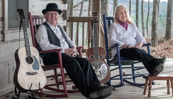 Bill and Maggie Anderson sitting in rocking chairs