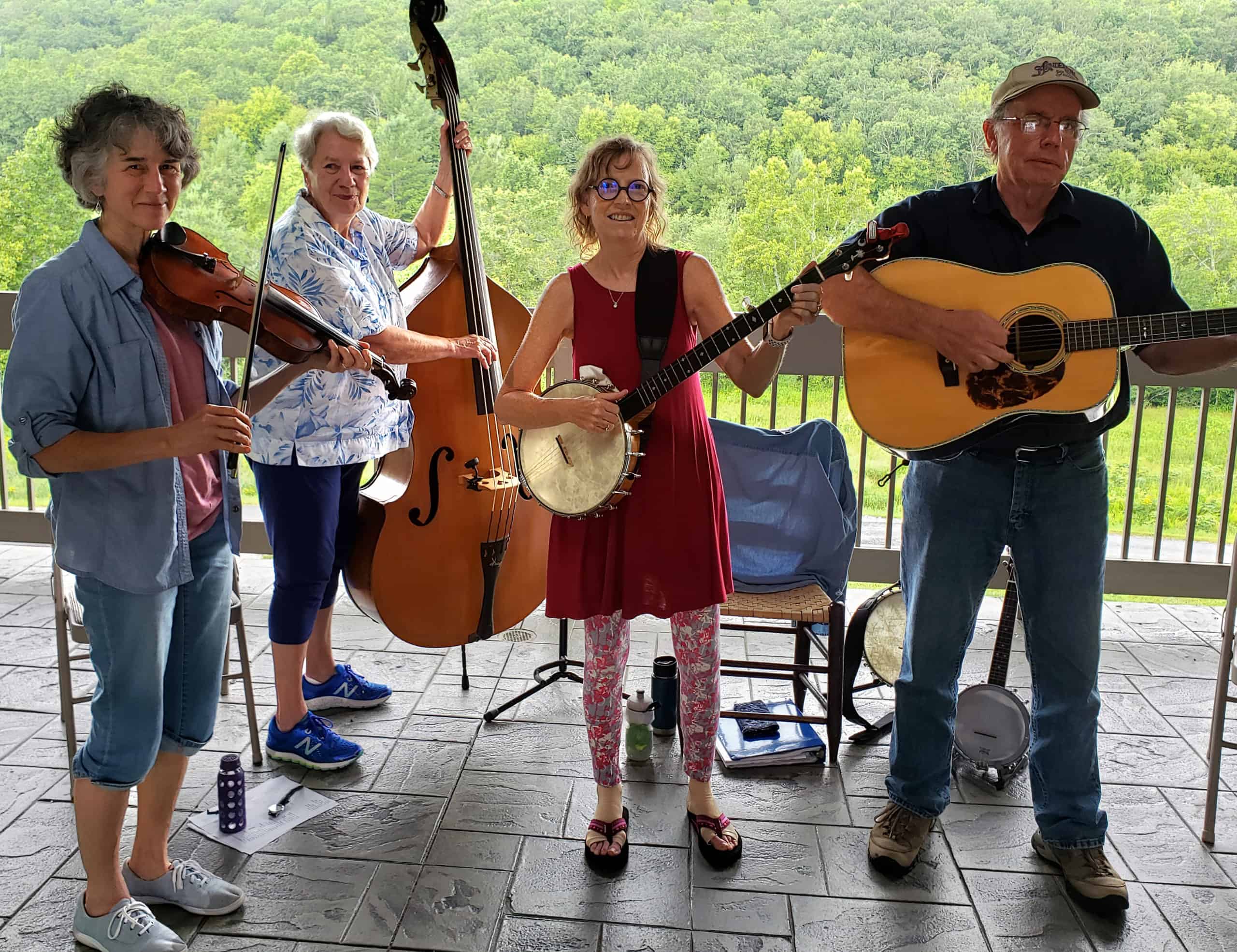 Miss Ellie and the Buck Mountaineers playing music and smiling
