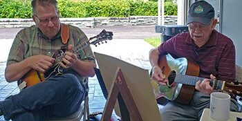 Scott Freeman and Willard Gayheart playing mandolin and guitar