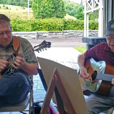 Scott Freeman and Willard Gayheart playing mandolin and guitar