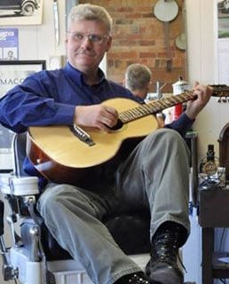 Jim Lloyd playing acoustic guitar