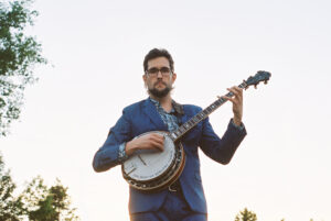 Joe Troop holding a banjo